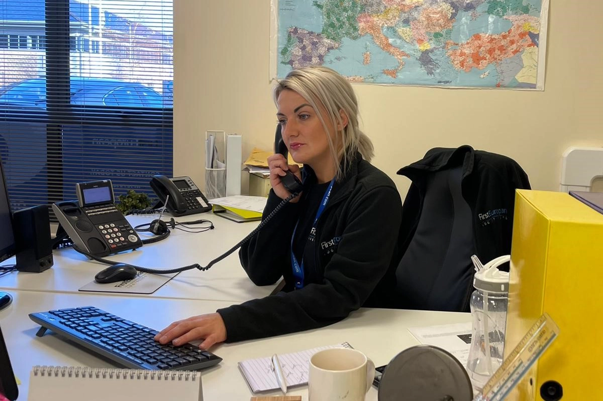 Office team member on the phone at First European Logistics